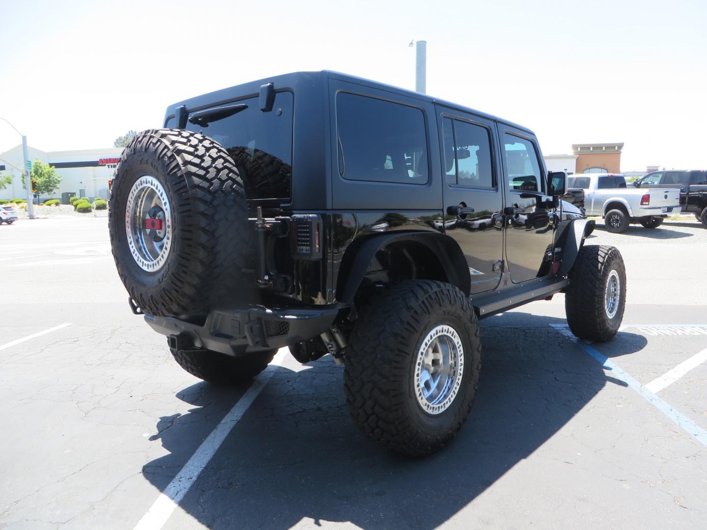 2017 BLACK /BLACK Jeep Wrangler Unlimited Rubicon 4WD (1C4BJWFG5HL) with an 392 Hemi Swapped engine, located at 2630 Grass Valley Highway, Auburn, CA, 95603, (530) 508-5100, 38.937893, -121.095482 - !!!!!!!!!!! NOT FOR SALE IN CA !!!!!!!!!!!!!! 392 Hemi swapped JK with a ton of extras...... Teraflex Long arm suspension system, Fox 2.0 remote reservoir shocks, Fox ATS steering stabilizer, Teraflex bump stops, Limit straps, Adams front and rear drivelines, Teraflex exhuast spacer, Dakota Custo - Photo#4